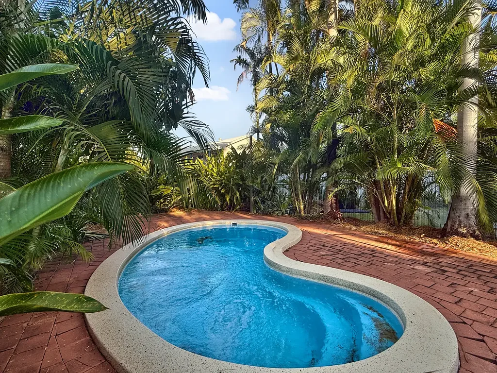 ELEVATED TERRITORY LIVING | POOL & TROPICAL GARDENS
