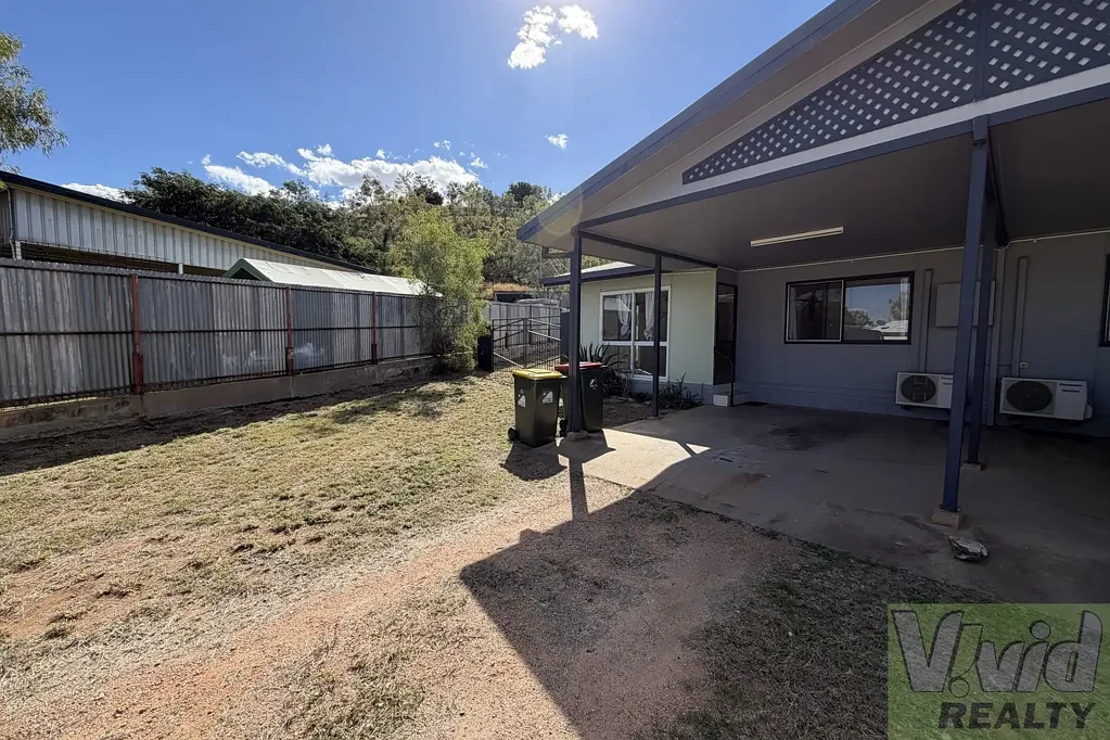 Charming Two-Bedroom Unit with Spacious Yard and Living Areas