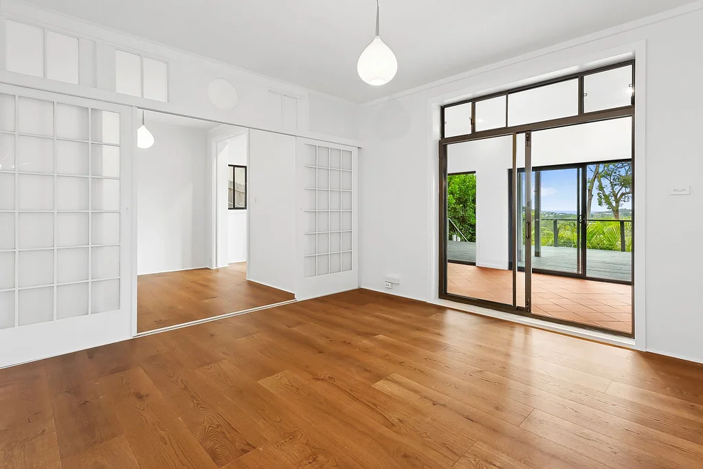 Coastal-Inspired Lower Duplex Home with Ocean Views and Exceptional Entertaining Space