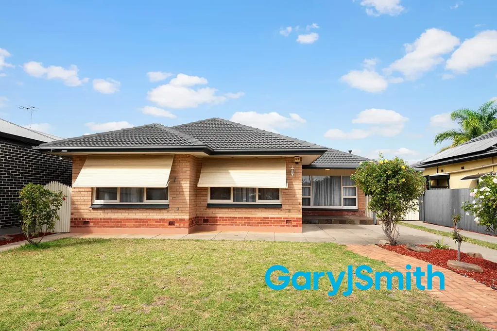 Charming 3 Bedroom Home with drive through garage