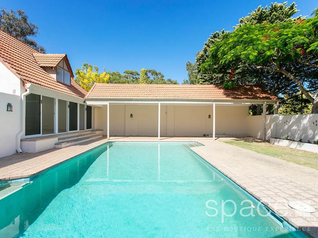 Large unfurnished family home on corner block with pool and pool house