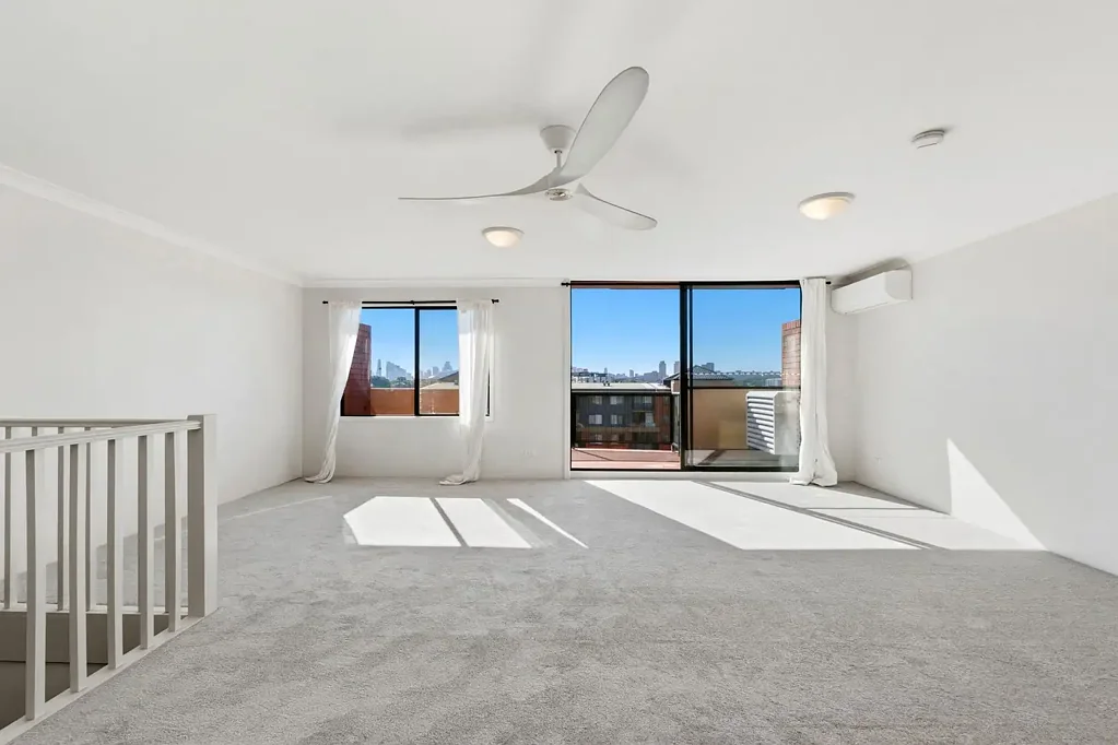 Top floor split level apartment with city views