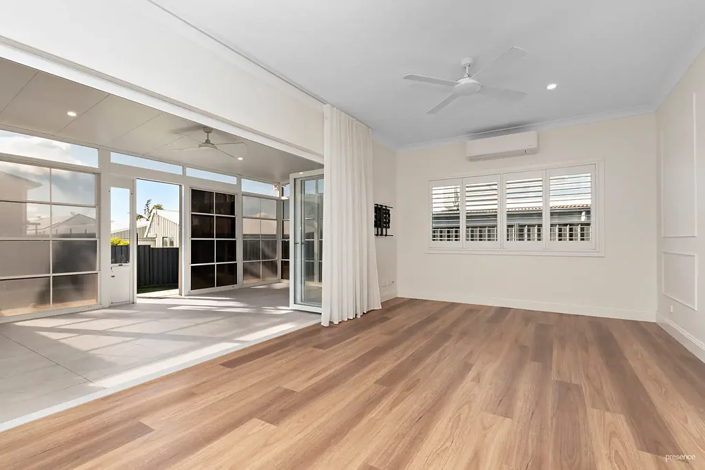 LIGHT-FILLED HOME WITH SUNROOM AND SECURE YARD