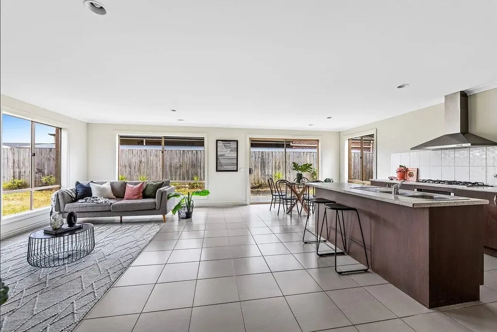"Immaculate 4 Bedroom Home with 2 Spacious Living Zones, Double Garage &   
  room for a caravan or trailer!"