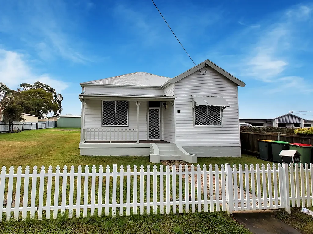 Character Cottage with White Picket Fence