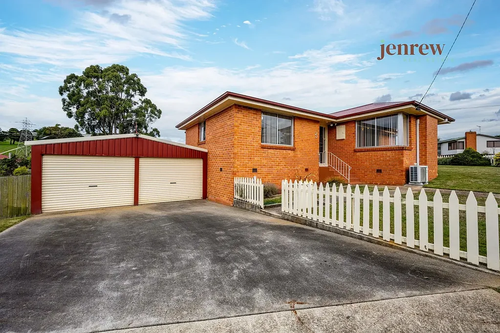 Dual driveways, double garage, brick!