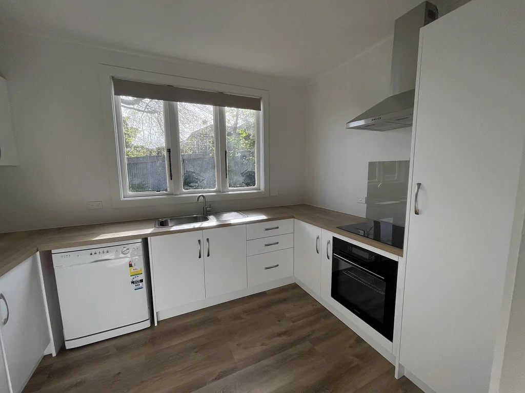 Sunny Renovated Home with no Lawns to Mow!