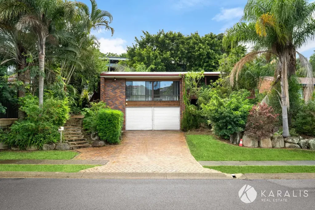 Executive Living - Character-filled split-level home with lush gardens & garage