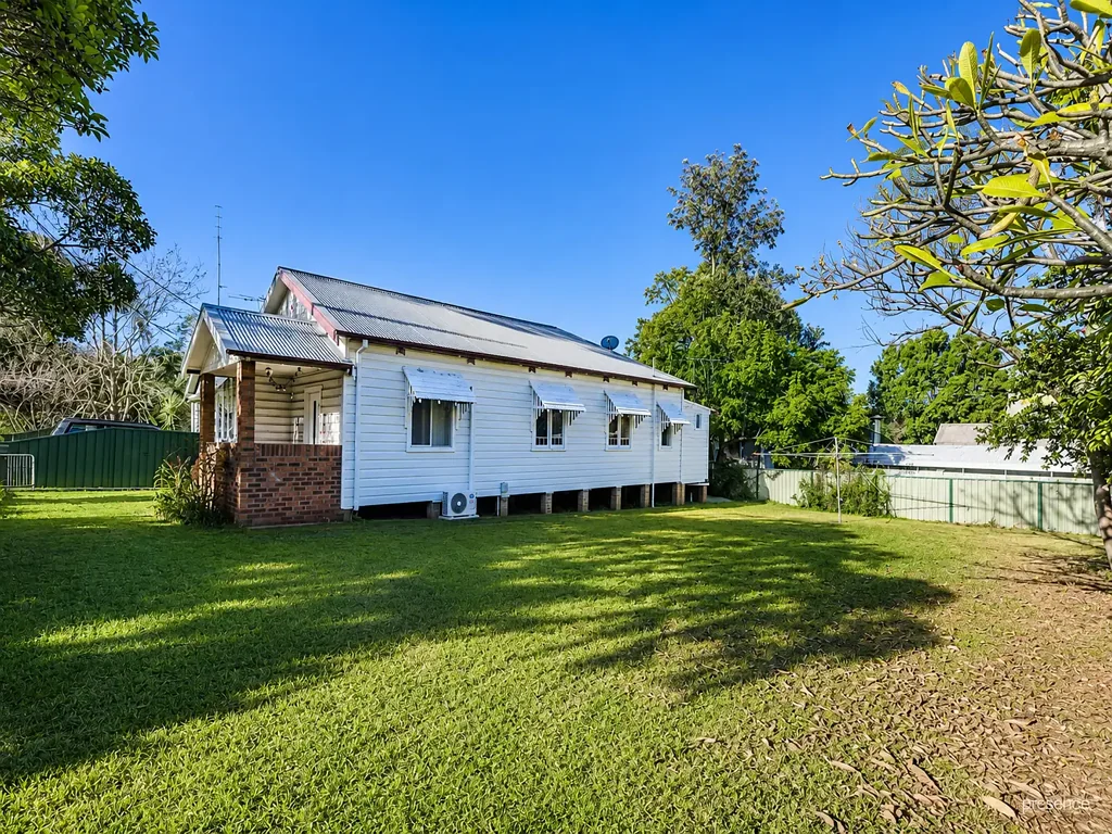 CHARMING CHARACTER HOME ON A HUGE BLOCK WITH OFF-STREET PARKING