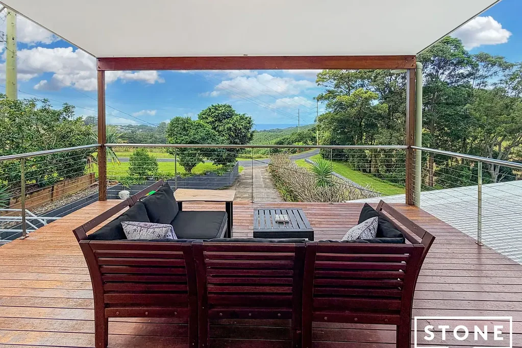 Perched high above Coffs Harbour, this elevated residence captures breathtaking panoramic ocean and mountain views across the Coffs Coast.