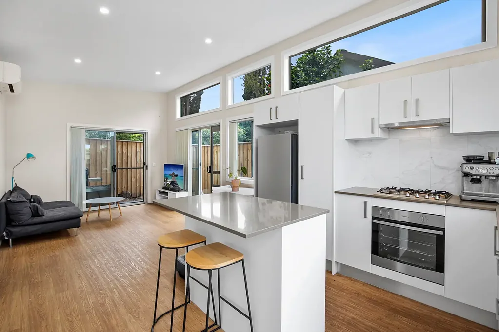 As new spacious granny flat with courtyard and parking, level walk to beach!
