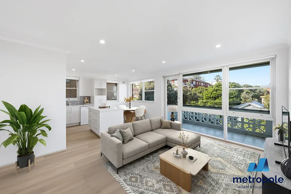 RECENTLY UPDATED WITH FRESH PAINT AND BRAND NEW FLOORING – TWO BEDROOM APARTMENT WITH ELEVATED OCEAN VIEWS AND LOCK UP GARAGE