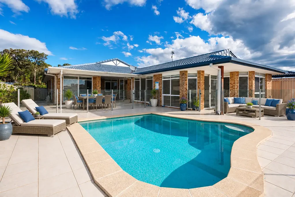 NORTH-FACING WATERFRONT LIVING WITH POOL, PONTOON & BOAT RAMP