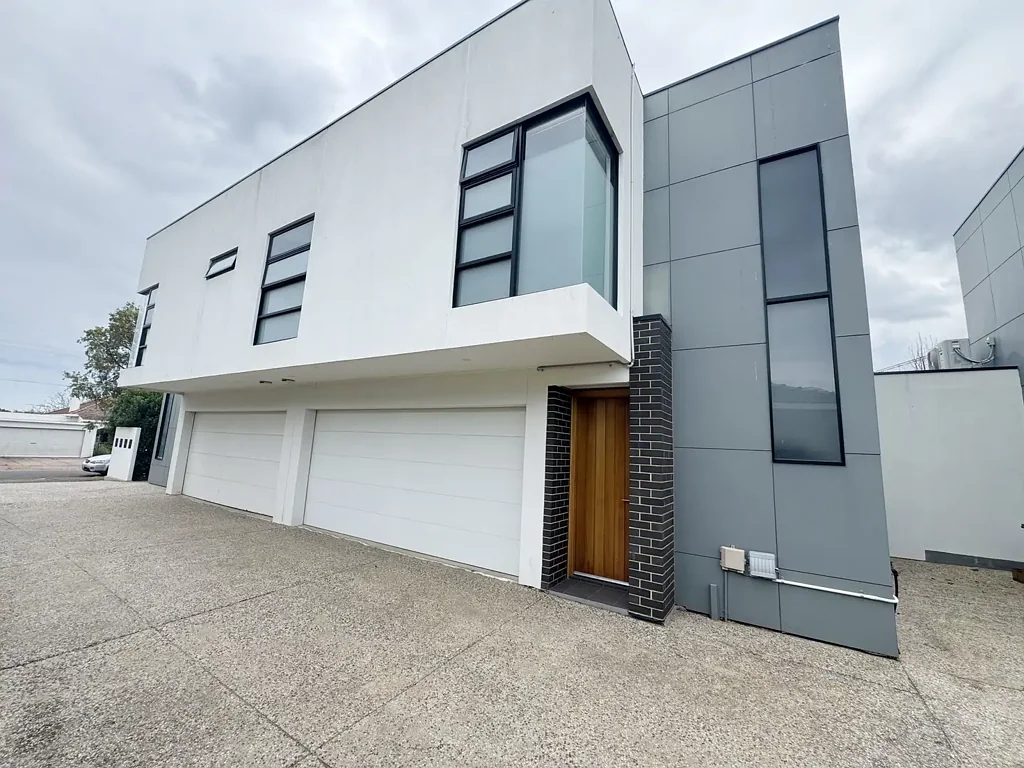 Stylish Three-Bedroom Townhouse with Spacious Living and Double Garage