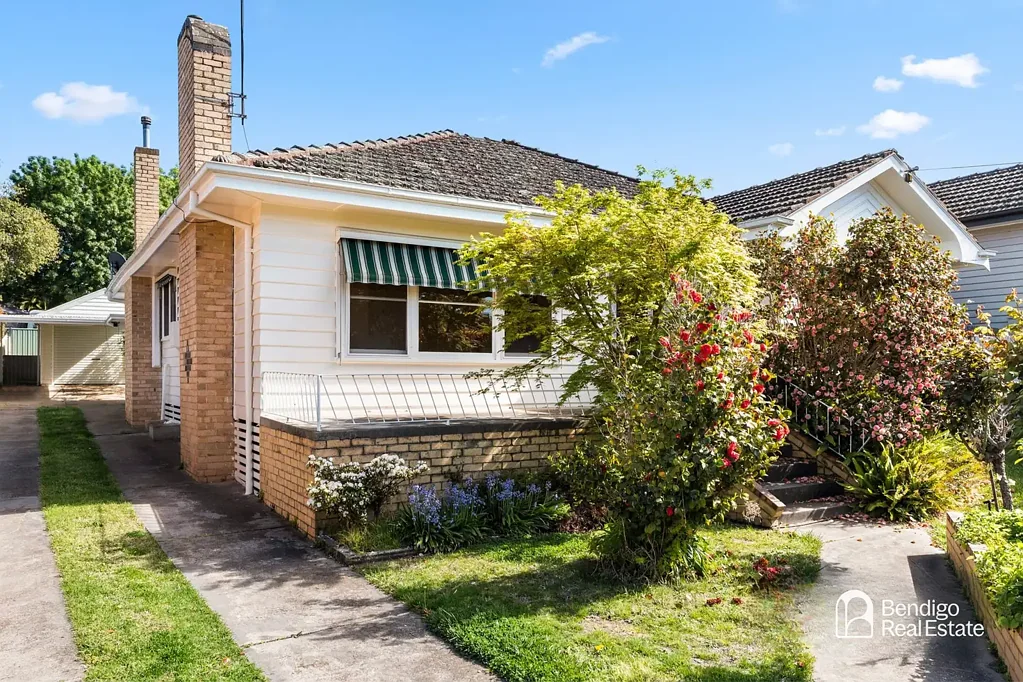 FOUR-BEDROOM HOME WITH SHED AND GARAGE